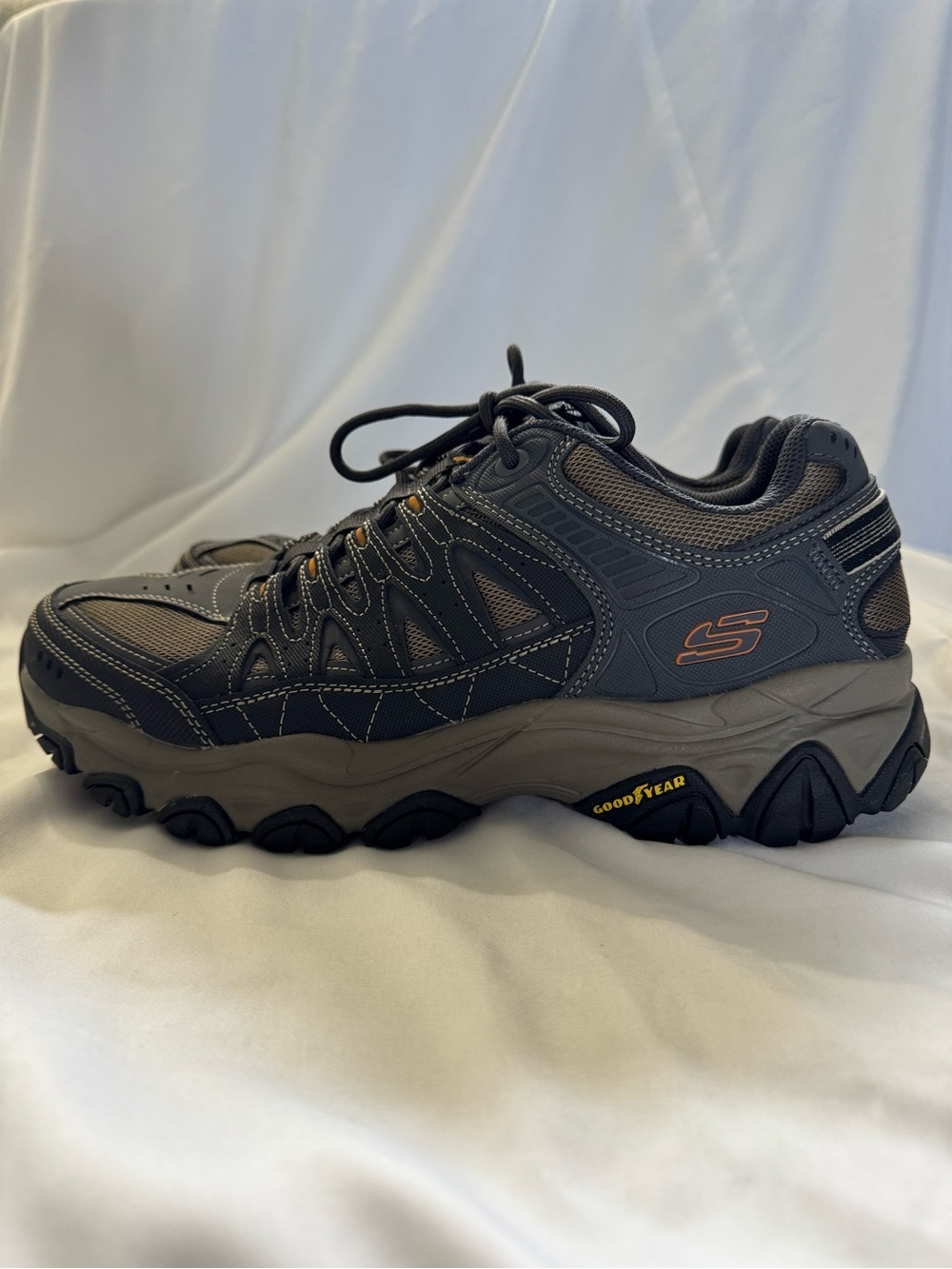 Skechers Men's Gray and Black Trail Sneaker with Subtle Orange Accents